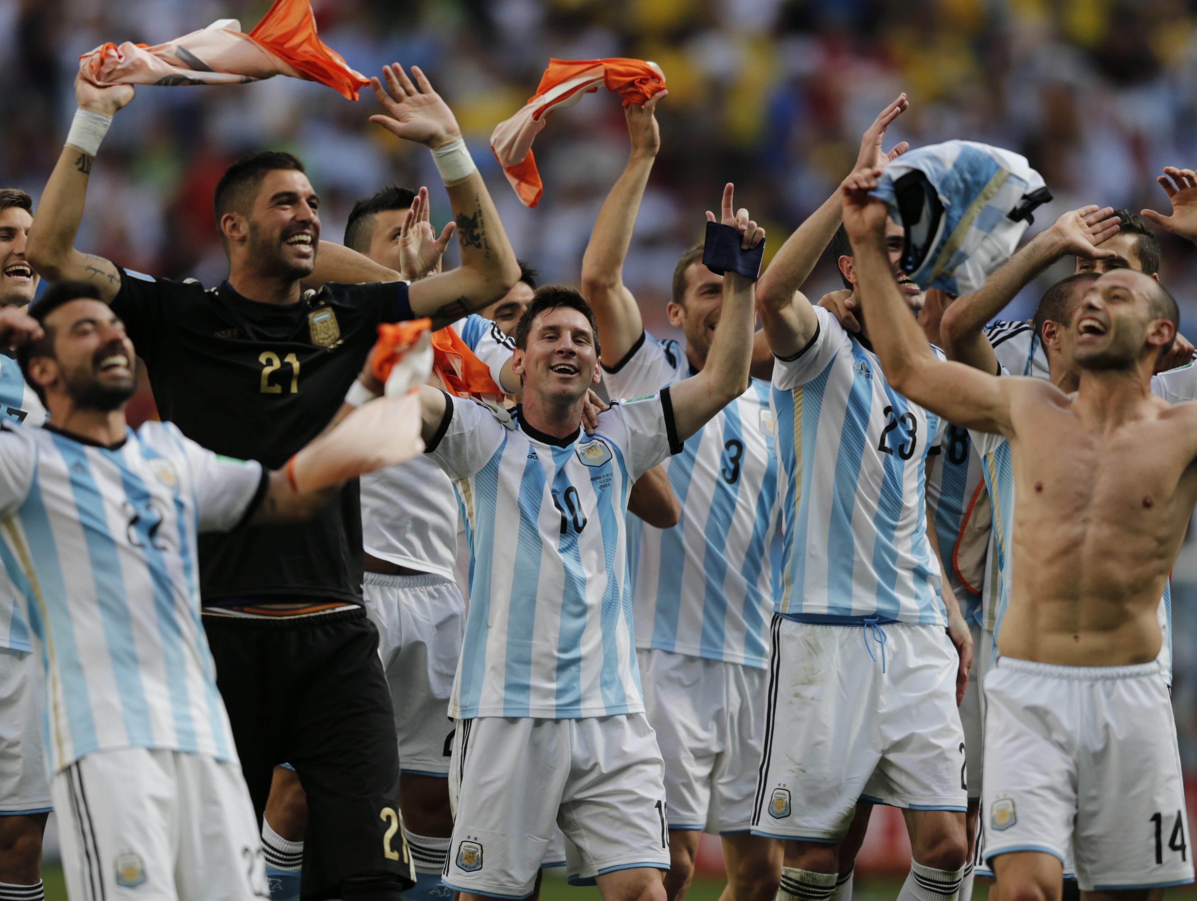 Argentina's Lionel Messi and teammates celebrate at the end of the World Cup quarterfinal soccer match between Argentina and Belgium at the Estadio Nacional in Brasilia, Brazil, Saturday, July 5, 2014. Argentina won 1-0. (AP Photo/Eraldo Peres) ORG X