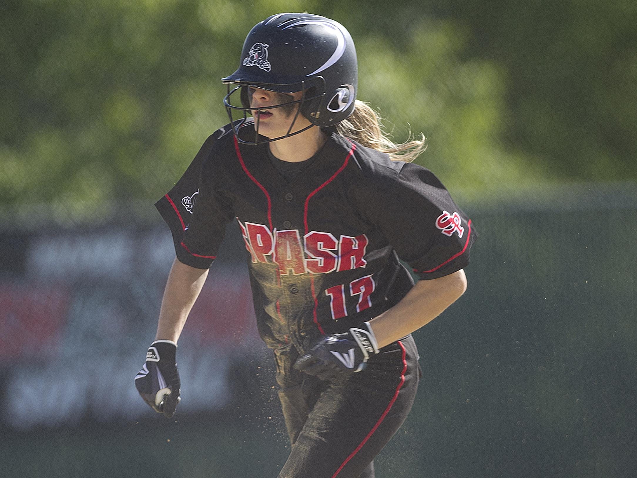 Stevens Point Area Senior High School’s Ally Miklesh steals third base, then steals home base during the first inning of the sectional semifinal playoff softball game against Superior at Woyak Sports Complex in Plover.