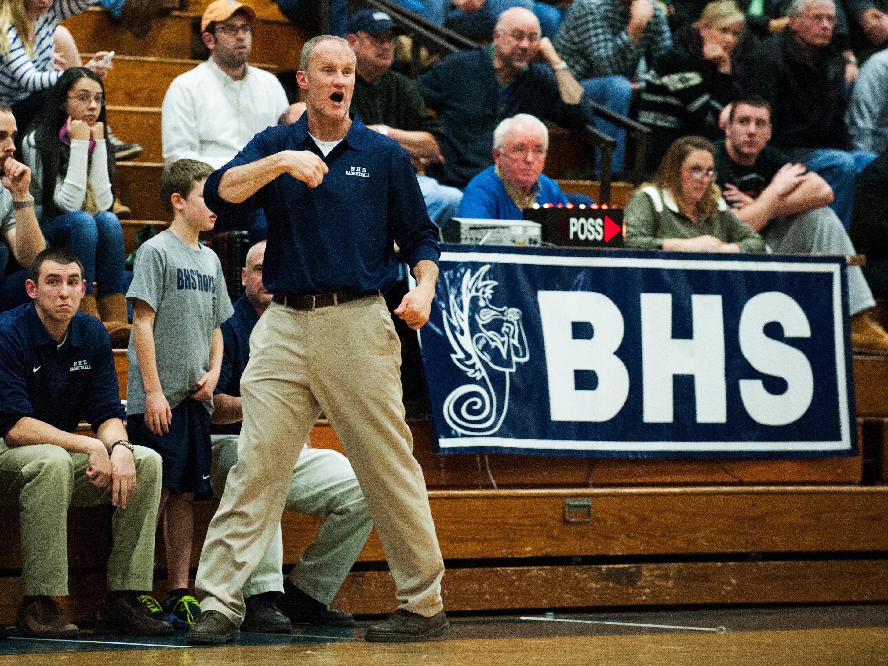 Burlington head coach Matt Johnson talks to his tema on the court during the boys basketball game between the Rice Green Knights and the Burlington Seahorses at BHS high school on Tuesday night December 9, 2014 in Burlington, Vermont. (BRIAN JENKINS, for the Free Press)