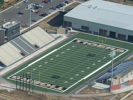 Bentonville High School’s stadium holds 6,000 people and boasts a synthetic turf field and sky boxes.