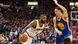Kyrie Irving drives to the basket against Klay Thompson