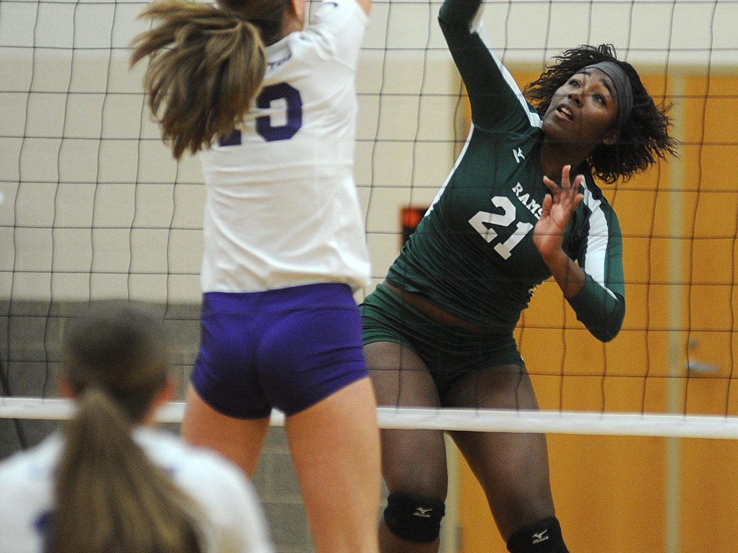 Madison’s Kamilla Brown hits the ball during a Division II district volleyball match against Lexington at Seneca East High School last season. The Rams have a new coach in Mandy Glessner and several new faces to go with Brown this year.