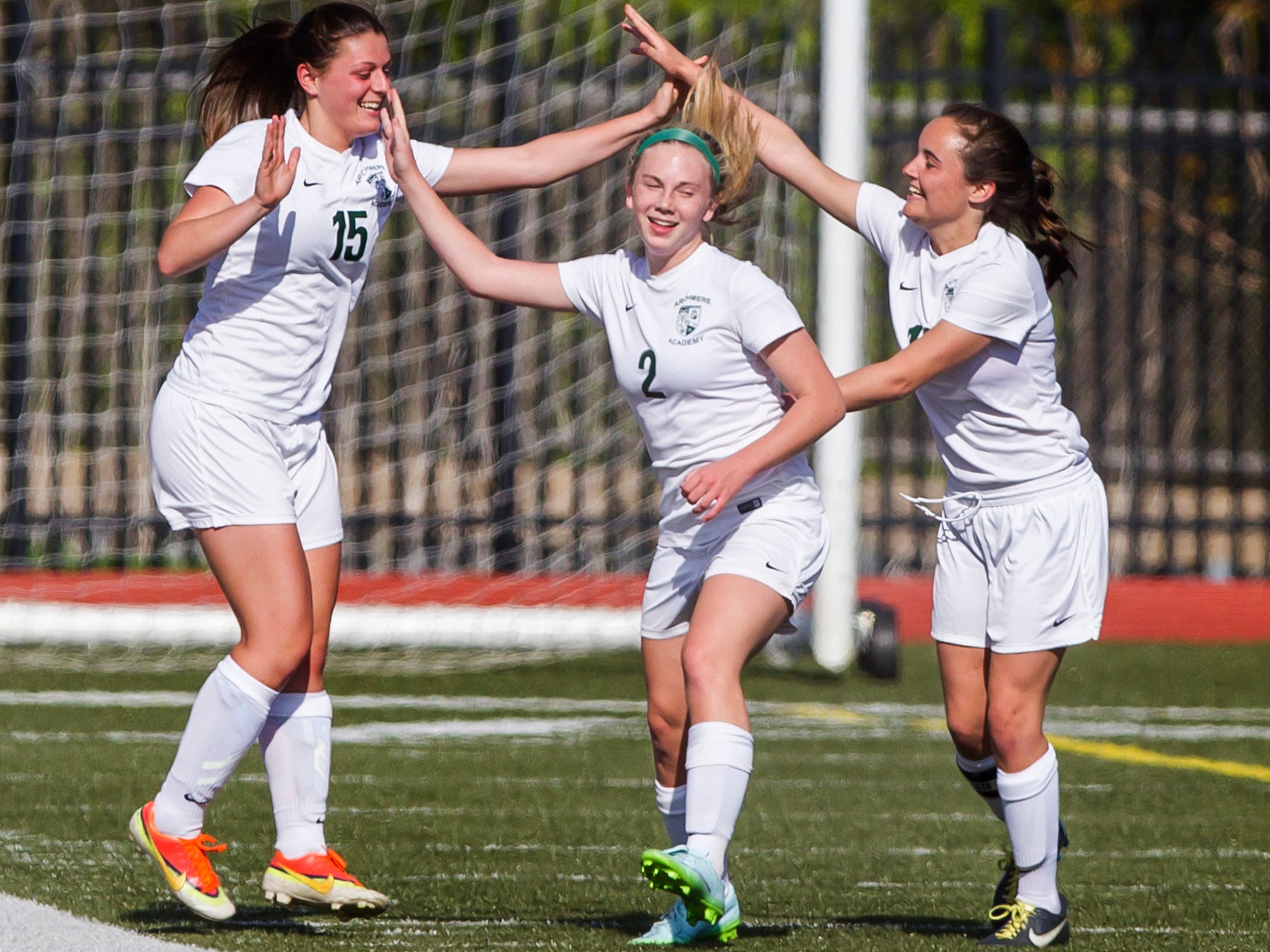Archmere’s Madeline Law (left), Madison Love (right) and Madelyn Heck (center) celebrate after a corner kick by Law deflected off a St. Mark’s player and into the goal. Archmere defeated St. Mark’s by a score of 2-1.