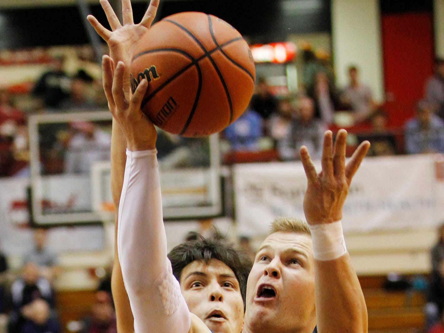 McCutcheon's Tyson Scheumann gets past Benito Munoz of Harrison for a score in the semifinals of the J&C Hoops Classic Friday, December 4, 2015, at Lafayette Jeff. McCutcheon beat county rival Harrison 82-64 and will now face Lafayette Jeff in the J&C Hoops Classic final.