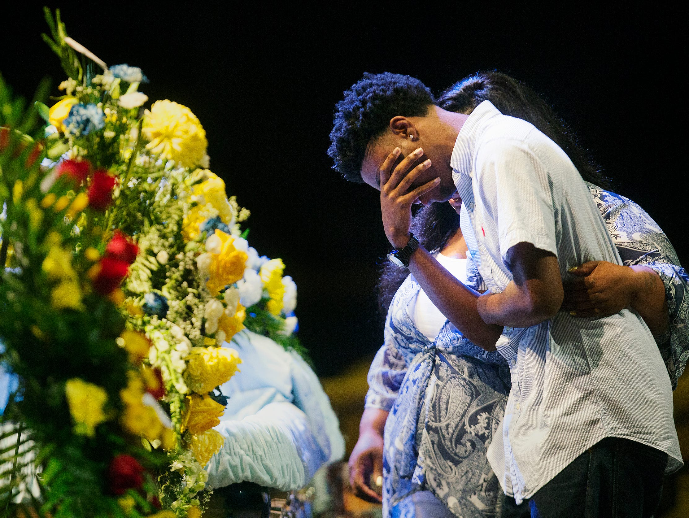 Anthony Sibert, 17, weeps at Stef'An Strawder's casket Saturday during Strawder's funeral at New Life Assembly of God in Lehigh Acres. Strawder was killed recently in the Club Blu nightclub shooting in Fort Myers. "Memories," of playing basketball with Strawder are what Sibert said he would cherish most.