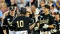Vanderbilt's John Norwood (10) is congratulated after he scores a run against Virginia during the 6th inning at the College World Series at TD Ameritrade Park in Omaha, Neb., Wednesday, June 25, 2014.