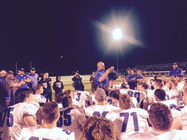 Utica Eisenhower coach Chris Smith addressed his team after a 26-13 win at Macomb Dakota on Sept. 1, 2016.