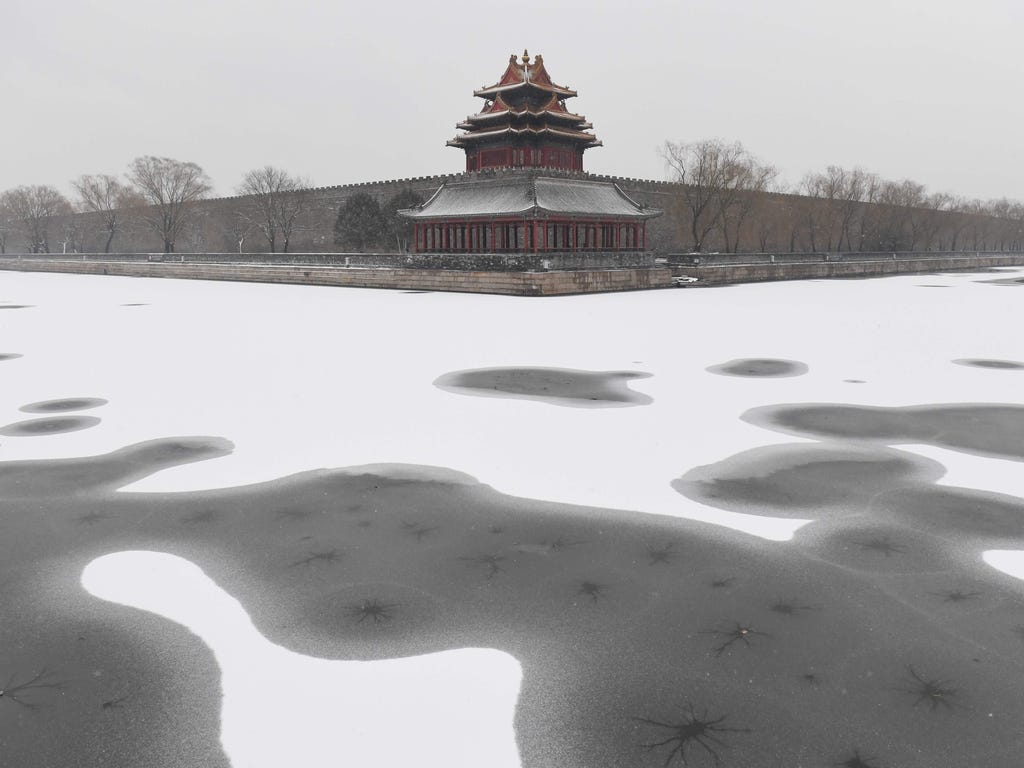 Snow covers the moat surrounding the Forbidden City in Beijing, China.