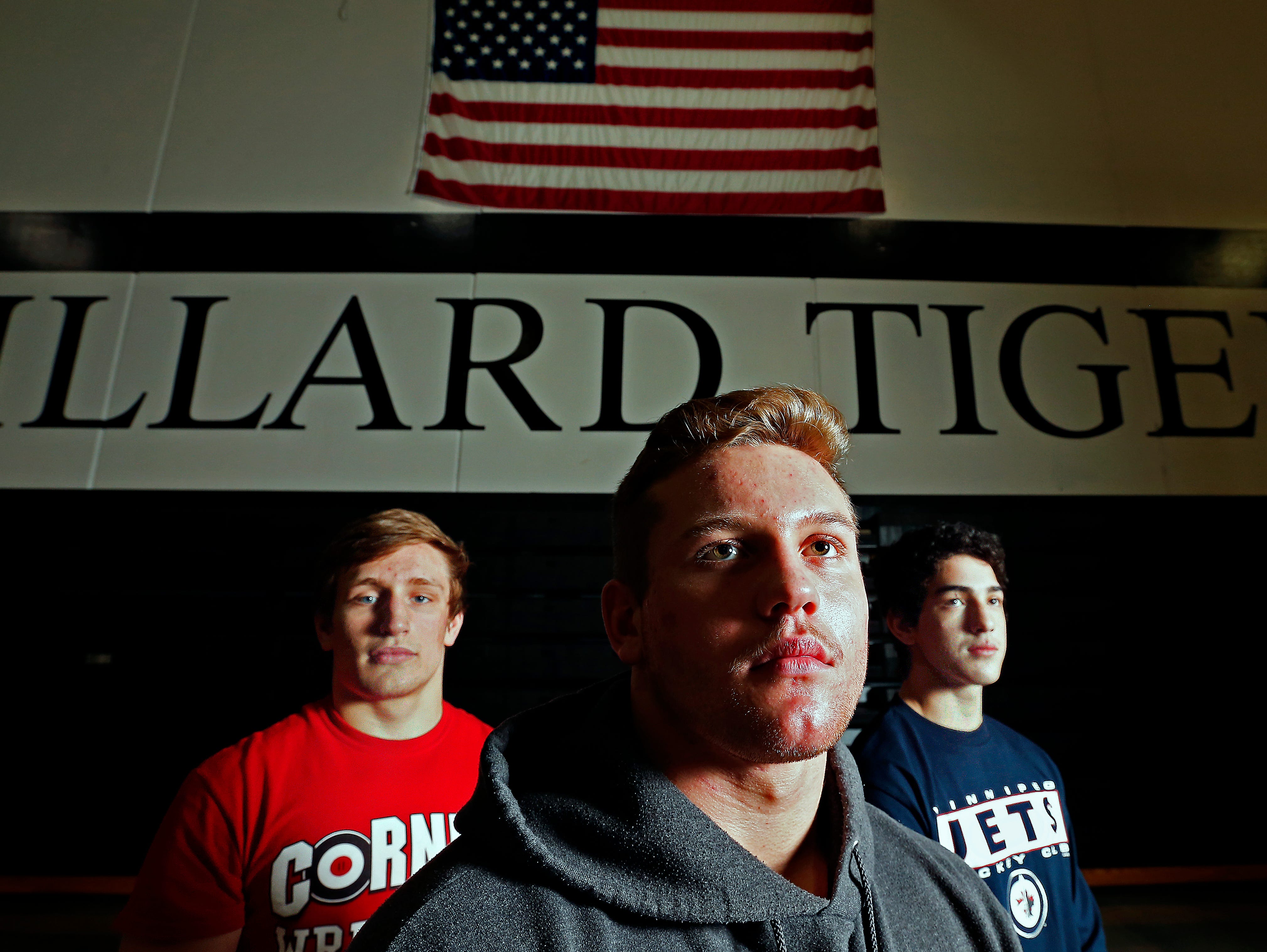 Willard High School wrestlers (from left) Kyle Caldwell, Hunter Yeargan and Niko Chavez took a break from training for the state wrestling tournament to pose for a portrait at the Willard High School gym in Willard, Mo. on Feb. 16, 2016.