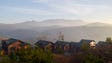 Smoke is in the distance behind homes in Gatlinburg,