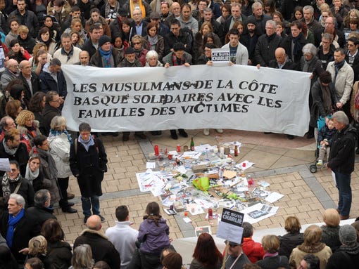 People hold a banner, reading "Muslims of the Basque