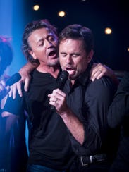 Mark Collie, left, and Charles Esten sing during Skyville