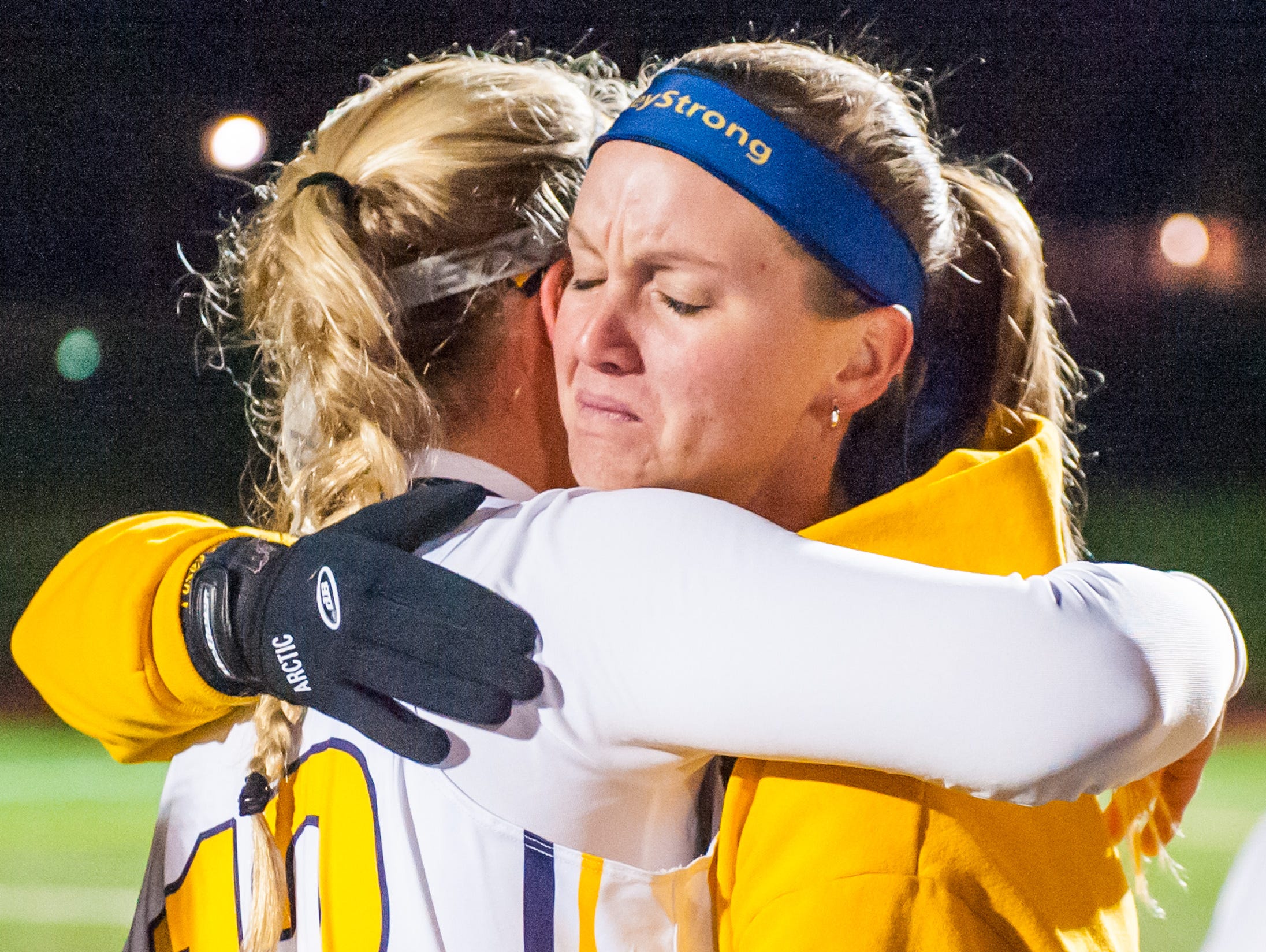 Pocomoke attack Lexi Butler (12) and head coach Brandi Castaneda embrace after winning the MPSSSAA 1A State Finals on Saturday evening at Washington College in Chestertown