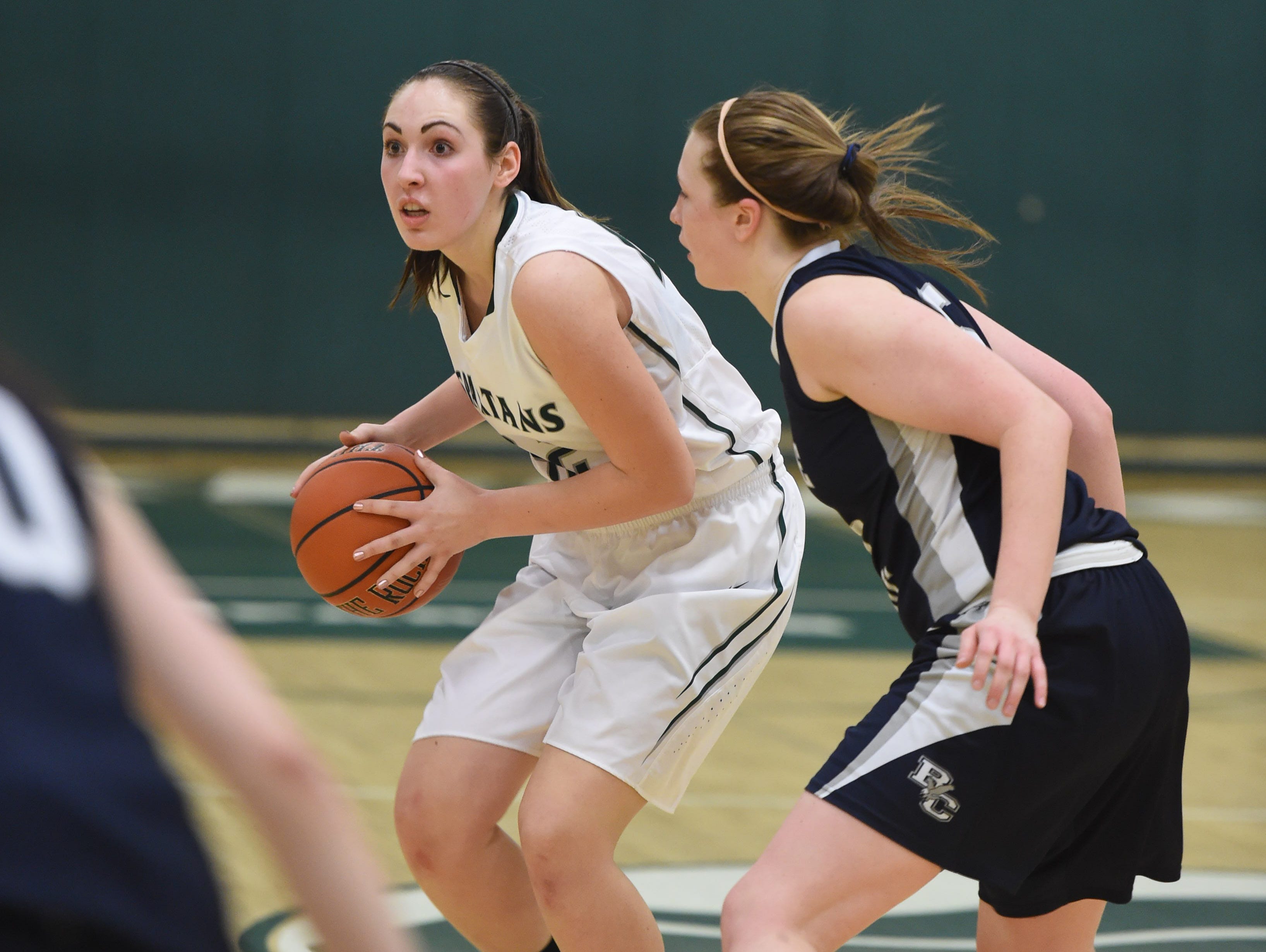 Spackenkill's Noelle Mancini is covered by Burke's Lauren Wapshare during Friday's Section 9 Class B semi-final at Spackenkill.