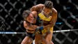 Amanda Nunes, right, and Miesha Tate compete during