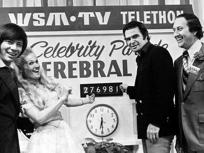 Bobby Goldsboro, left, Lynn Anderson, Burt Reynolds and Buddy Killen point to the total raised during the 10th annual WSM-TV Cerebral Palsy Telethon on March 9, 1974, at the Municipal Auditorium.