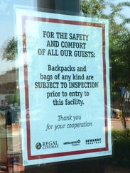 Signs are posted on the doors of Regal theaters in