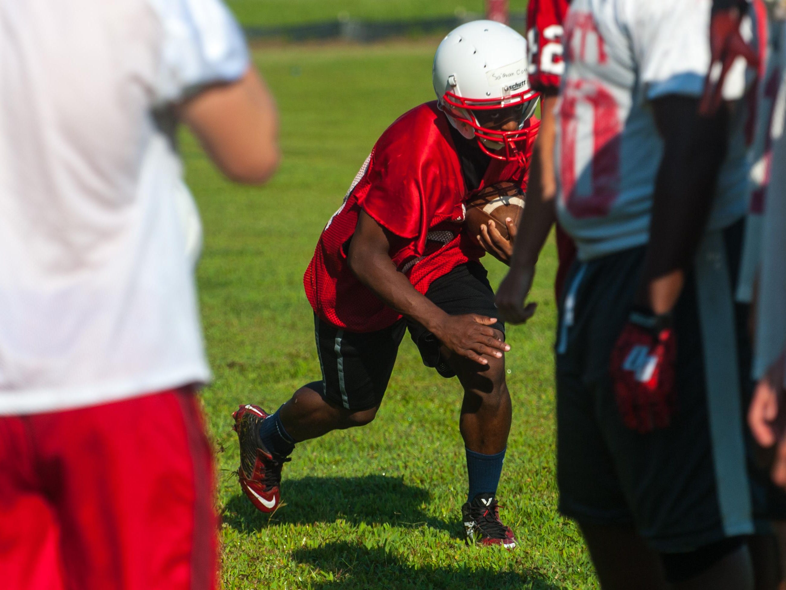 A James M Bennett running back works through drills on the second day of practice.