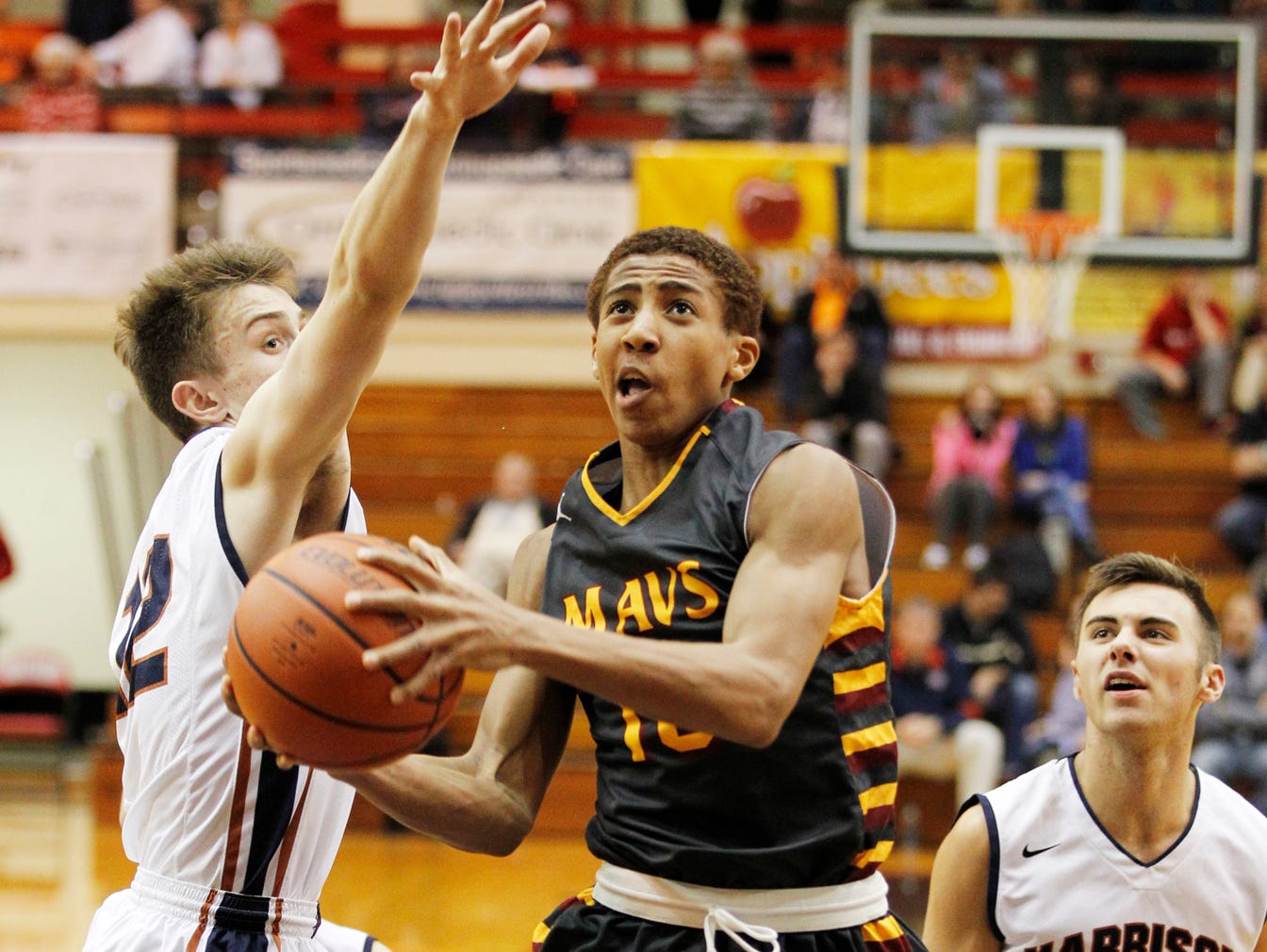 Robert Phinisee of McCutcheon drives to the basket against Harrison in the semifinals of the J&C Hoops Classic Friday, December 4, 2015, at Lafayette Jeff. McCutcheon beat county rival Harrison 82-64 and will now face Lafayette Jeff in the J&C Hoops Classic final.