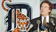 Detroit Tigers owner Mike Ilitch talks with reporters