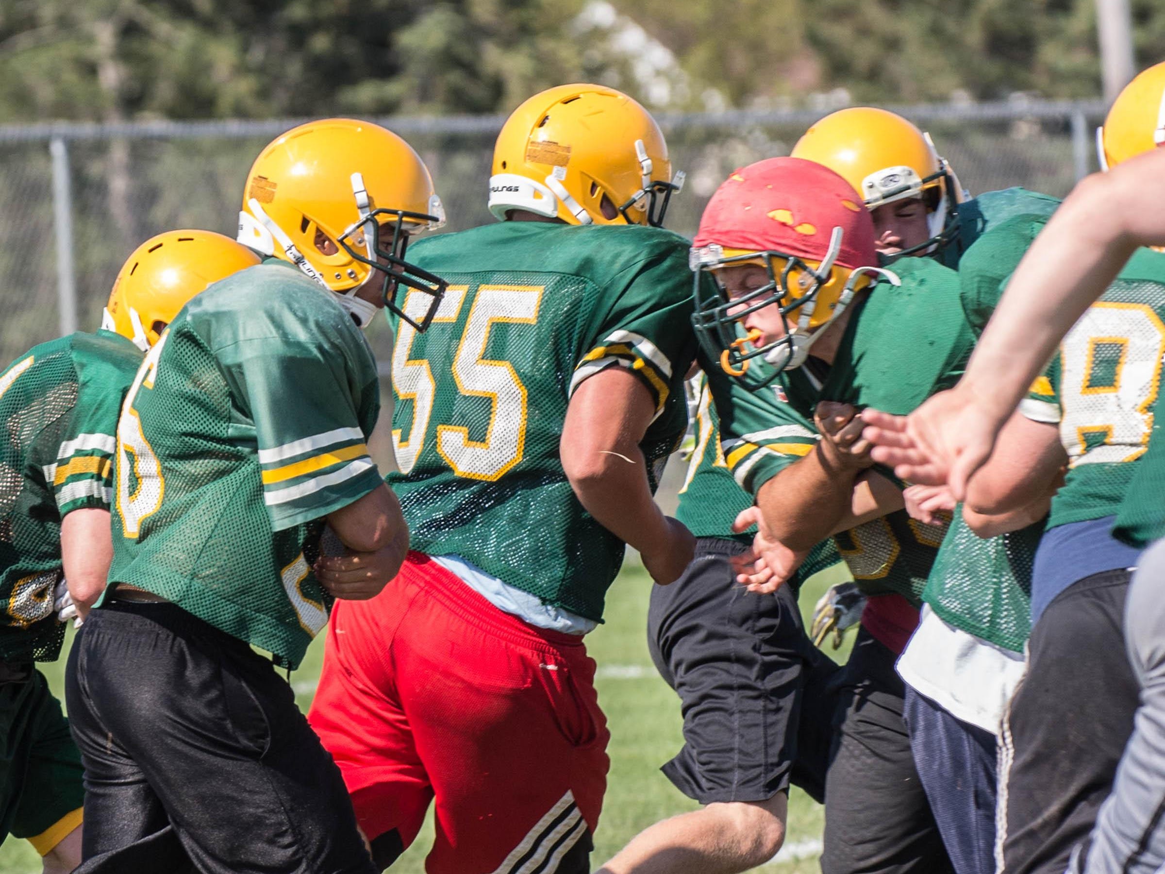First day of practice with full pad for Pennfield High School football team.