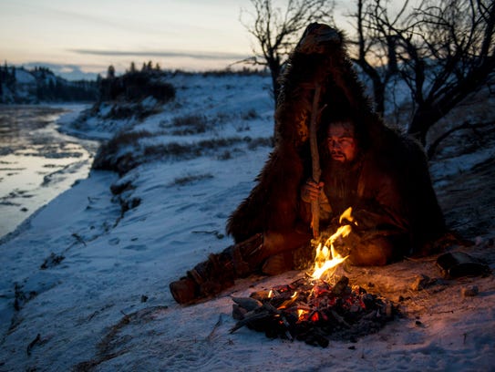 Hugh Glass (Leonardo DiCaprio) struggles to stay warm