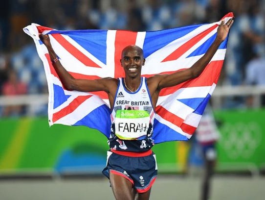 Mo Farah celebrates winning the Men's 5000m Final during