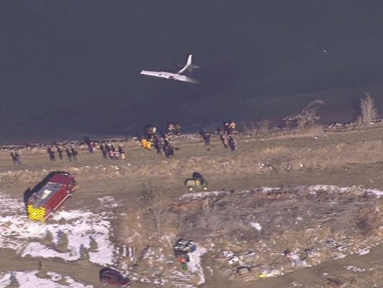 A Cessna 172 lies upside down in Culver Reservoir after