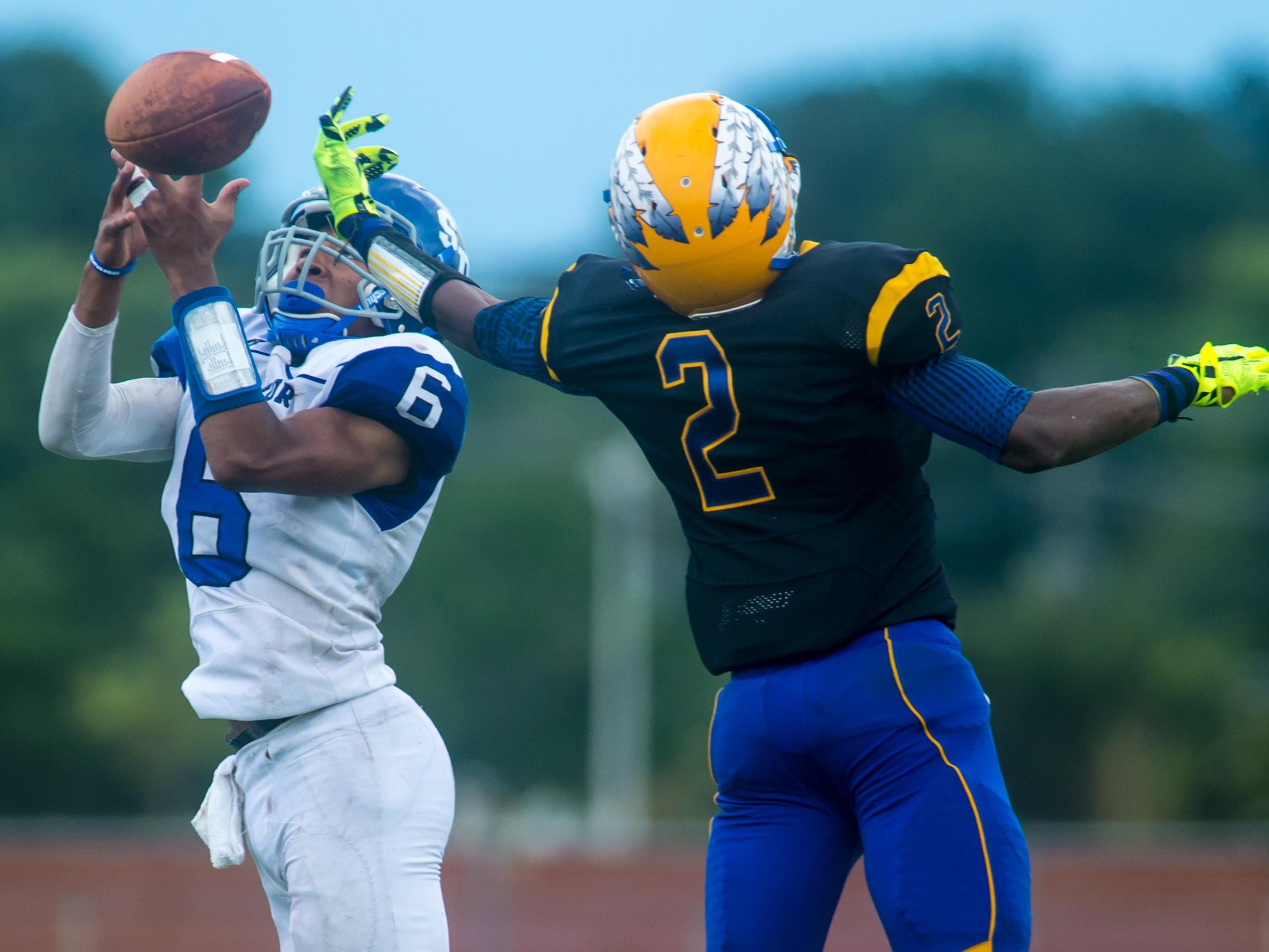 Stephen Decatur defensive back Darion McKenzie (6) attempts to pick off a Wicomico High pass intended for wide receiver Barry Gaines (2) on Saturday afternoon at Wicomico County Stadium.