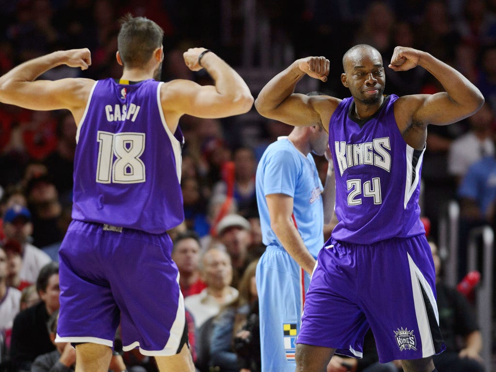 Sacramento Kings forward Carl Landry, right, celebrates with Sacramento Kings forward Omri Casspi after making a shot against the Los Angeles Clippers during the fourth quarter in Los Angeles. The Kings won 98-92.