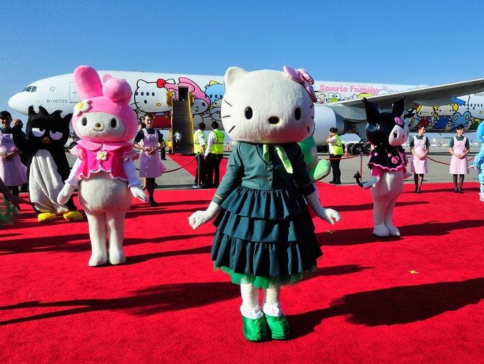 Performers dressed as Hello Kitty characters celebrate the arrival of the EVA Boeing 777-300ER Hello Kitty Jet on Sept. 18, 2013, at Los Angeles International Airport. Hello Kitty is celebrating her 40th birthday.