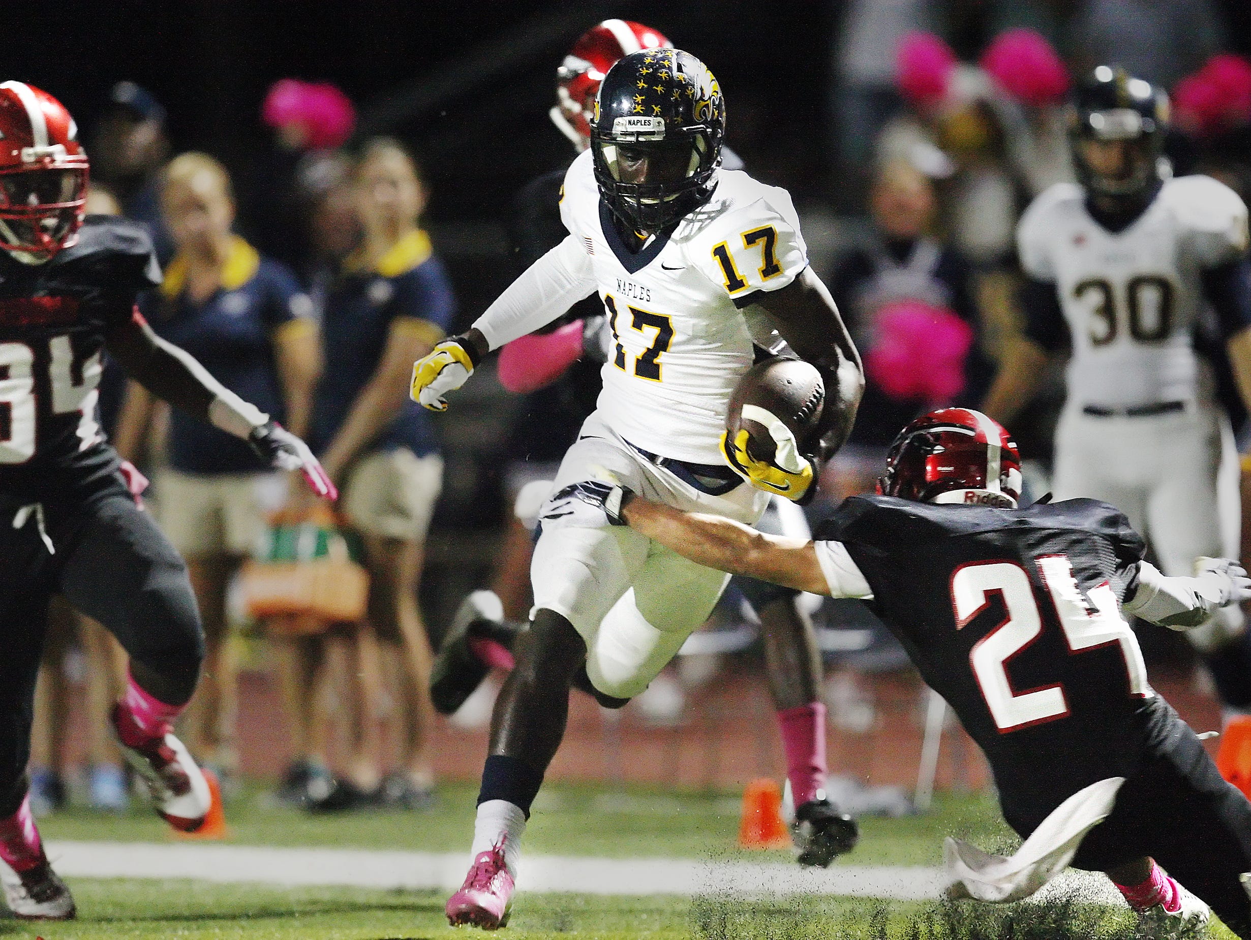 Naples High School's Tyler Byrd scores a touchdown against Immokalee last season at Immokalee High School.