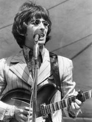 George Harrison plays at Crosley Field.