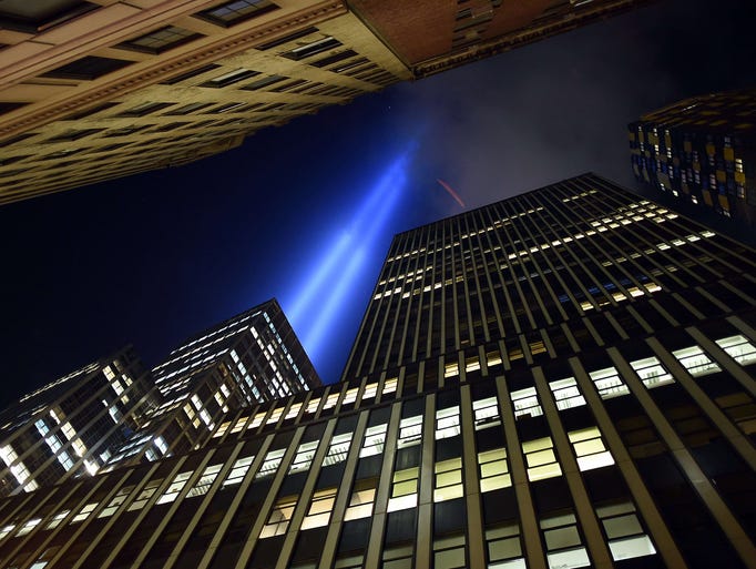 The Tribute in Light display illuminates the sky  down in the Wall Street area of lower Manhattan in New York on Sept. 10. The tribute, an art installation of the Municipal Art Society, consists of 88 searchlights placed next to the site of the World Trade Center creating two vertical columns of light in remembrance of the 2001 attacks.