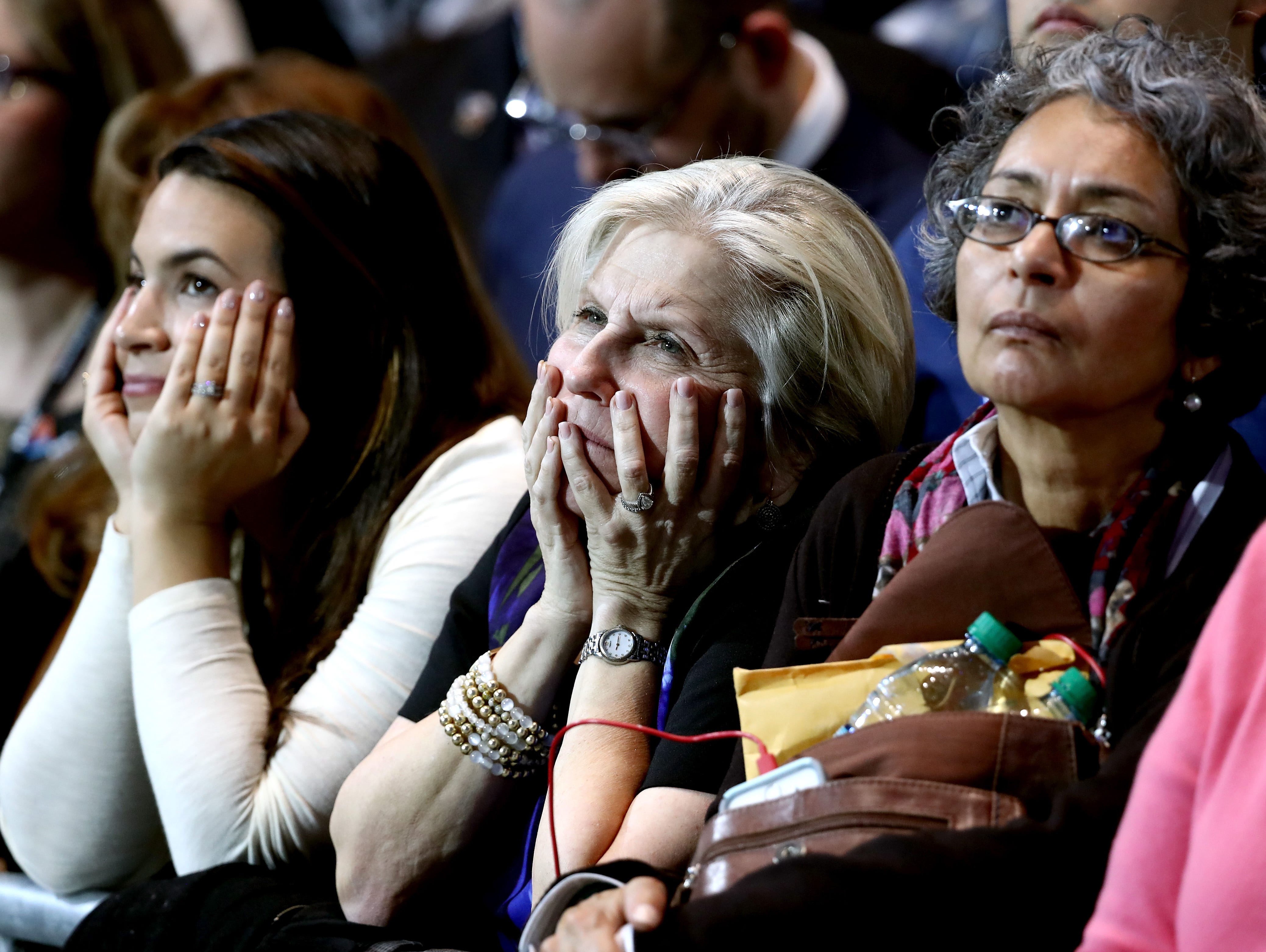 Three women watch the results at Hillary Clinton's election night event.