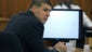 Aaron Hernandez listens during his murder trial at