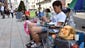 People set up their camps outside an Apple store in Tokyo on Sept. 12.