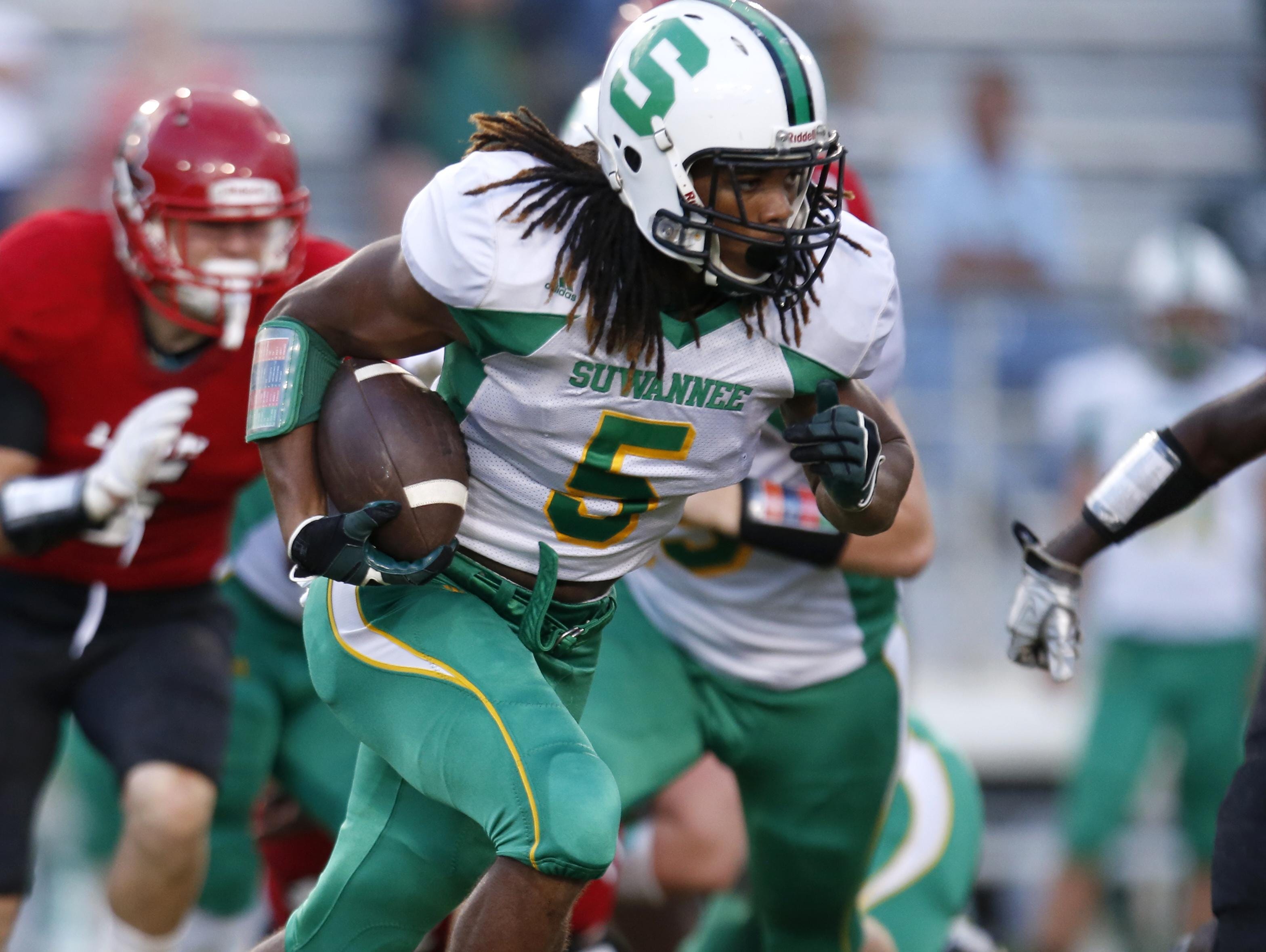 Suwannee's Aaron McAllister runs the ball against Leon during their game at Cox Stadium in the preseason.
