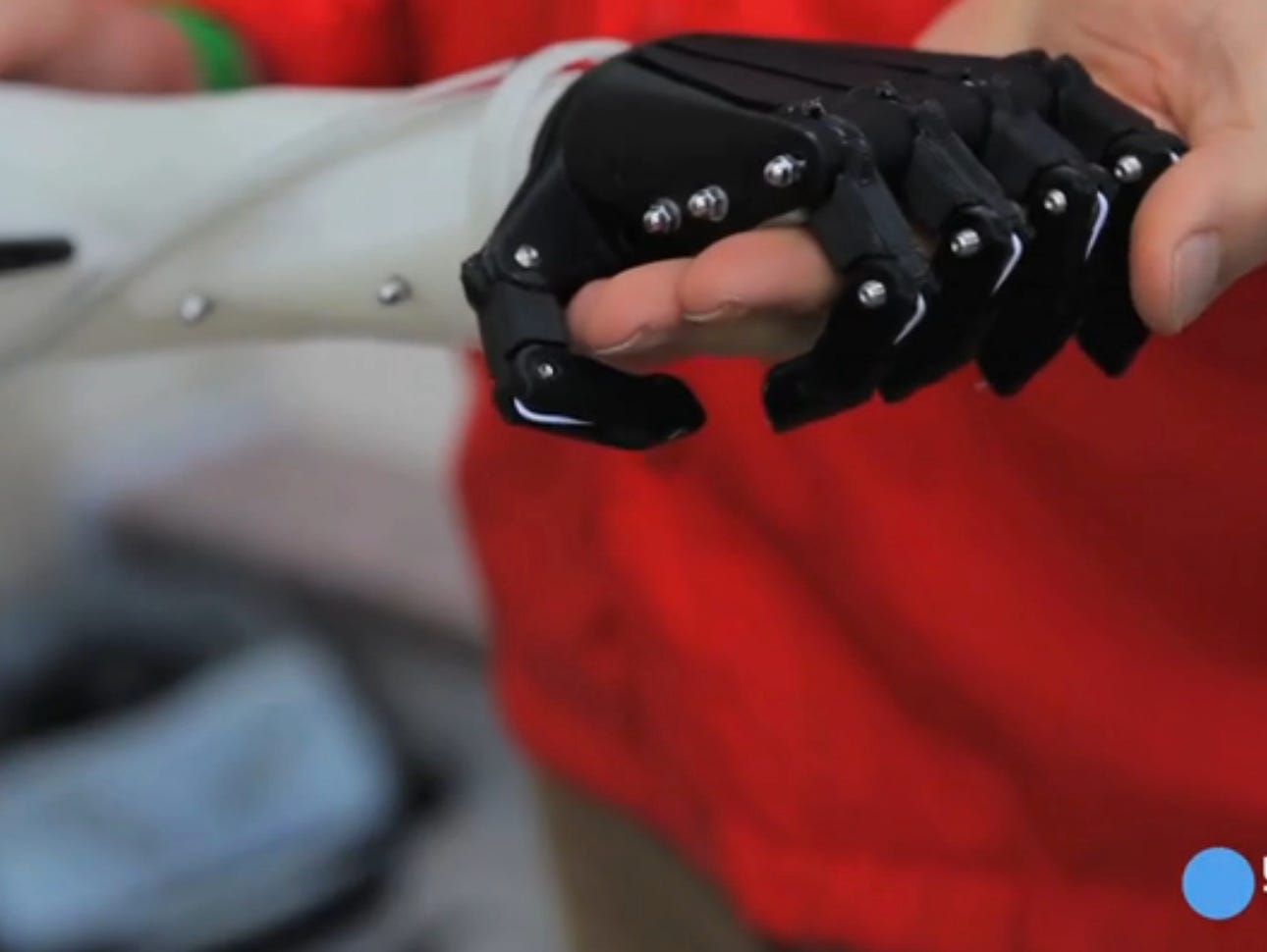 A copy of the prosthetic arm made with a 3D printer for $100 by nonprofit Not Impossible.