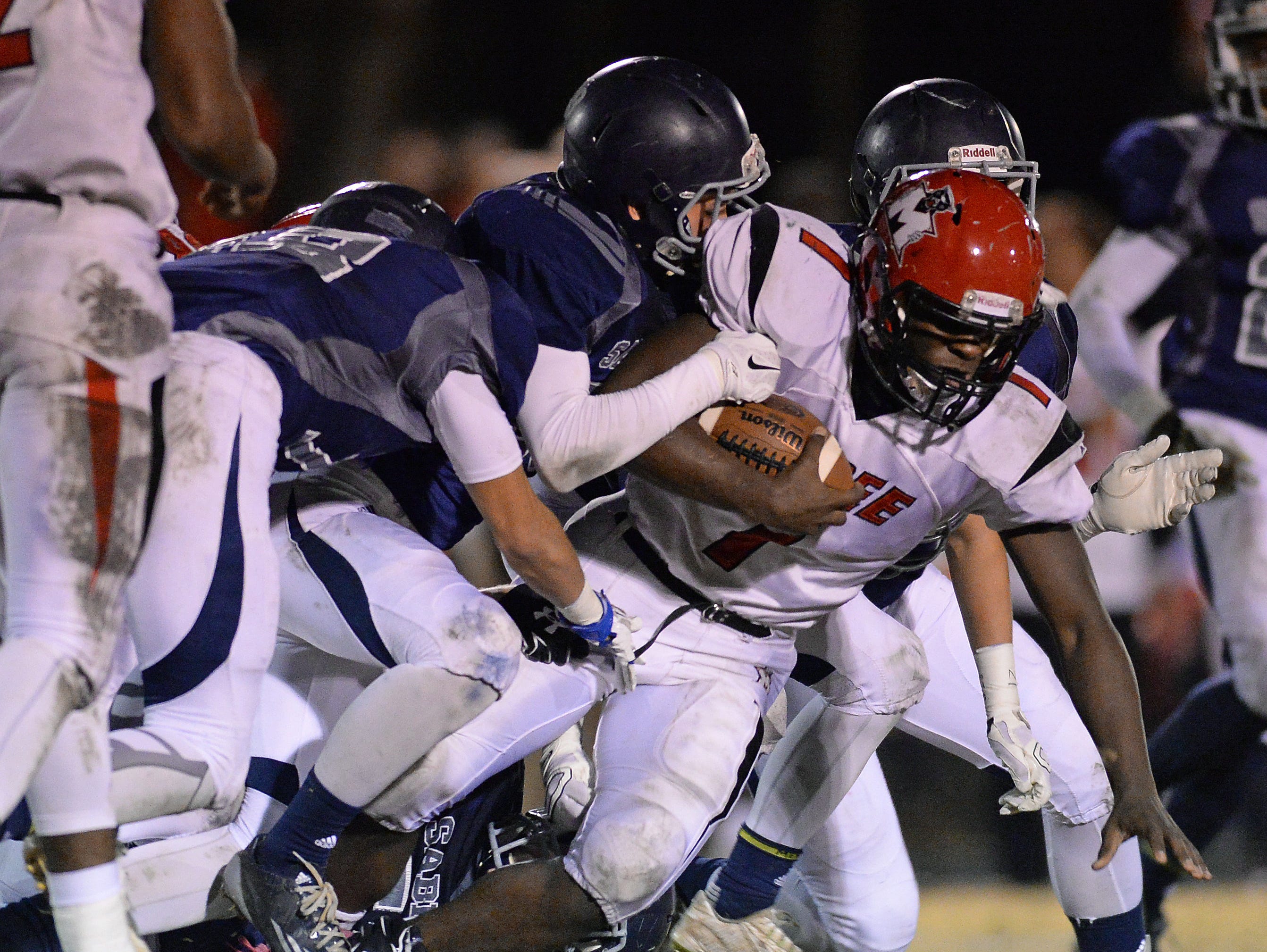 McBee's Dashonnell Wright (7) is brought down by the Southside Christian defense during the Class A Division I playoffs Friday, November 27, 2015.