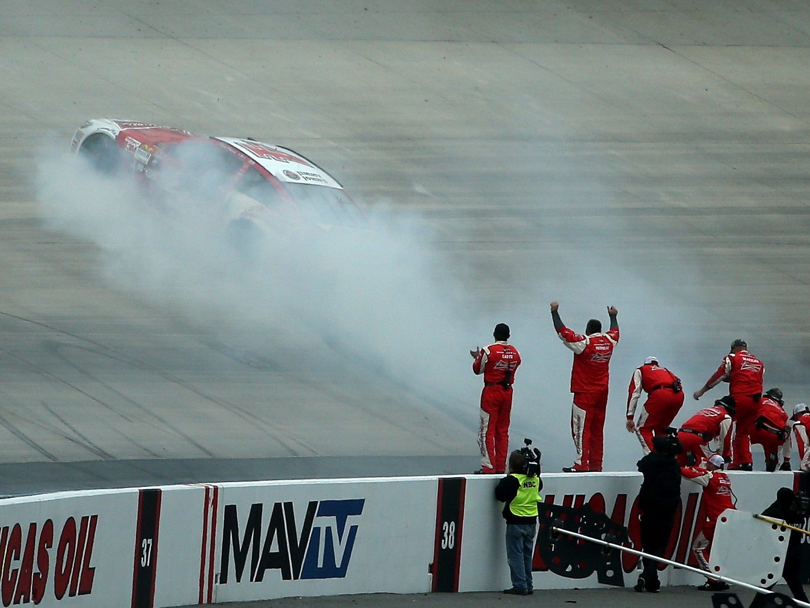 Kevin Harvick does a burnout after winning the AAA 400 at Dover International Speedway.