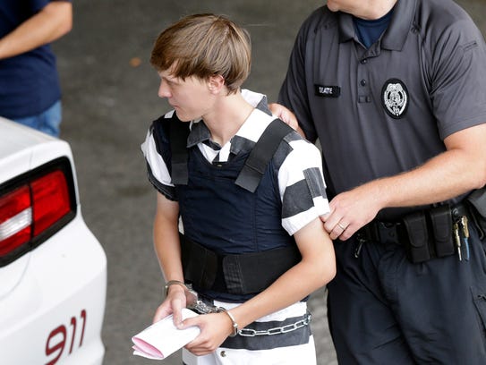 Dylann Roof is escorted from the Cleveland County Courthouse