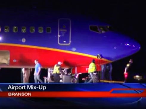 This frame grab provided by KSPR-TV shows a Southwest Airlines flight that scheduled to land Jan. 12 at Branson Airport in southwest Missouri.
