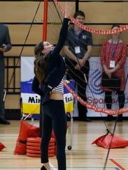 Duchess Kate reaching for ball
