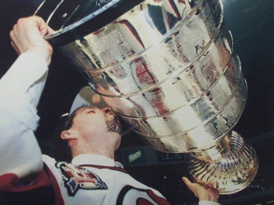 In this file photo, Jim Dowd kisses the Stanley Cup with the Devils in 1995.
