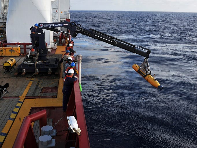 Workers on the ADF Ocean Shield launch a U.S. Navy Bluefin-21 robotic submarine.The Malaysian jet with 239 people on board disappeared March 8 during a flight from Kuala Lumpur to Beijing.