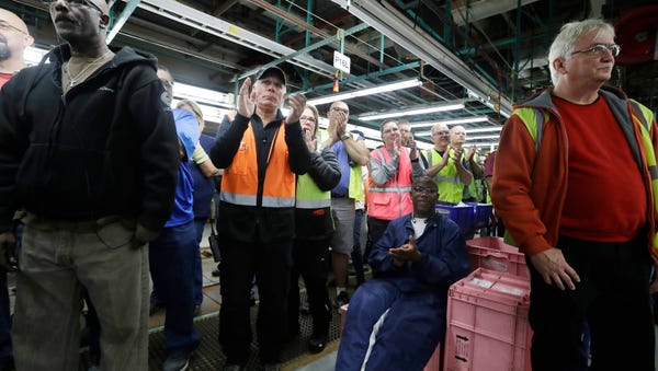 In this Tuesday, Jan. 3, 2017, file photo, Flat Rock Assembly employees clap as Ford President and CEO Mark Fields addresses the auto plant in Flat Rock, Mich. The threat from President Donald Trump to tax Mexican-made cars sold in the U.S. would throw the industry into disarray, analysts say. In early January, Ford made the surprise announcement that it would halt construction of a $1.6 billion plant in Mexico slated to build the compact Focus. It also announced plans to invest $700 million of that savings into a Michigan plant where it will make new electric and autonomous cars.