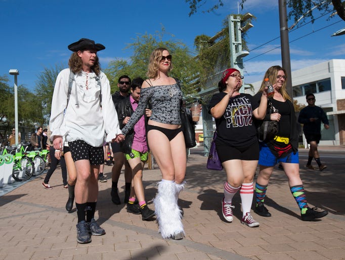 Pantless light rail riders get off the train in Phoenix