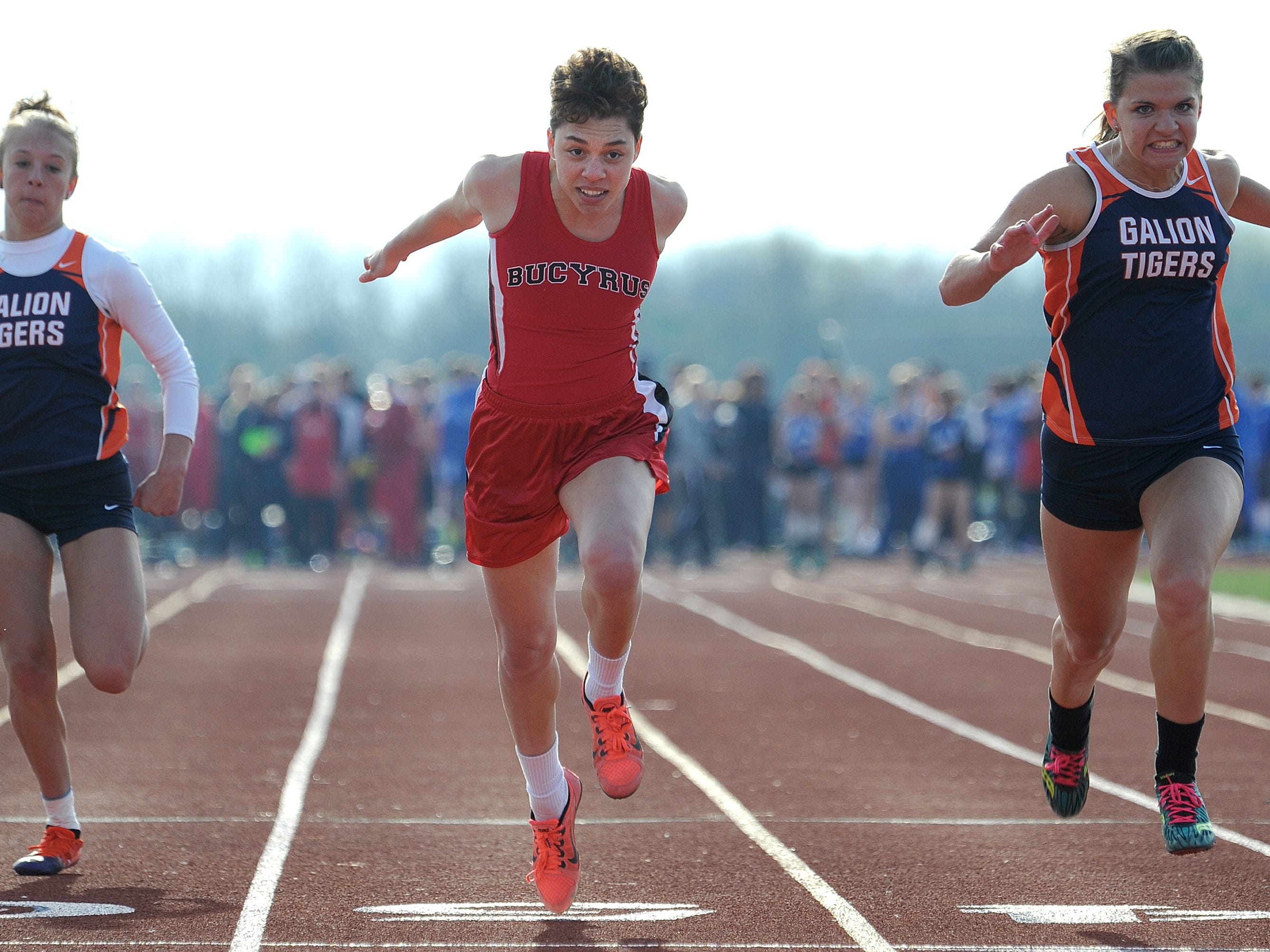 Bucyrus' Brittany Parsell stretches herself across the finish line of the 100 meter dash Friday evening at the Crawford County Track Meet.