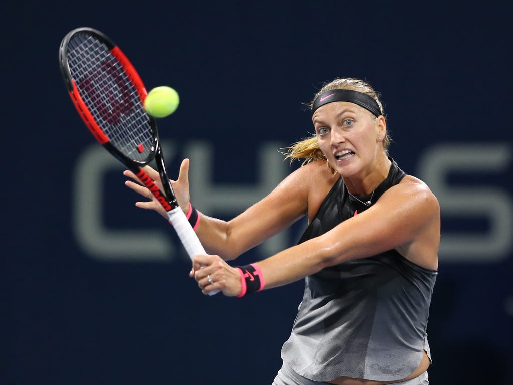 Petra Kvitova, of Czech Republic, returns a shot to Alize Cornet, of France, on day three of the U.S. Open tennis tournament at USTA Billie Jean King National Tennis Center in New York.